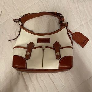 Cream and brown Dooney & Bourke never been used still has original bag